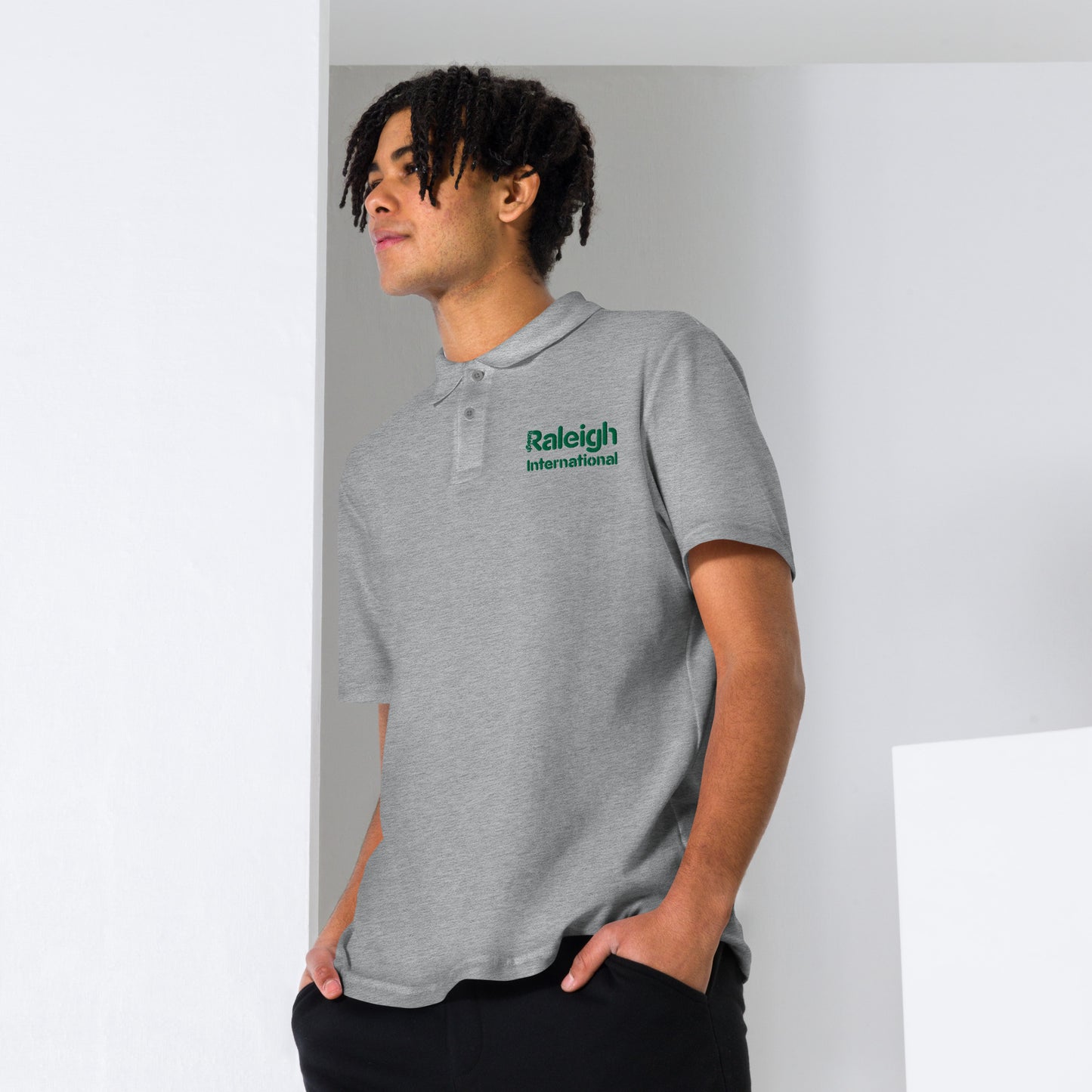 Raleigh unisex polo shirt (green logo)