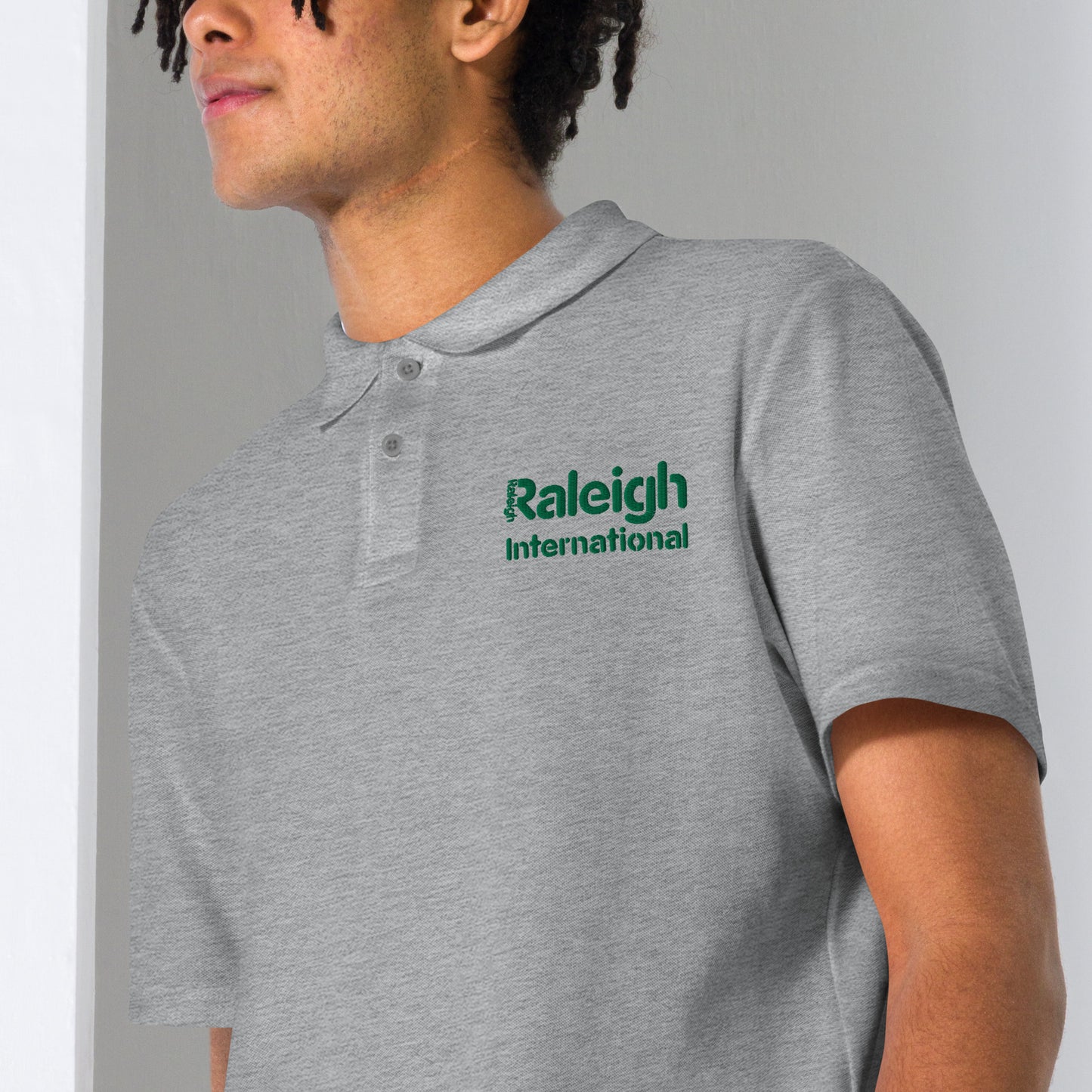 Raleigh unisex polo shirt (green logo)