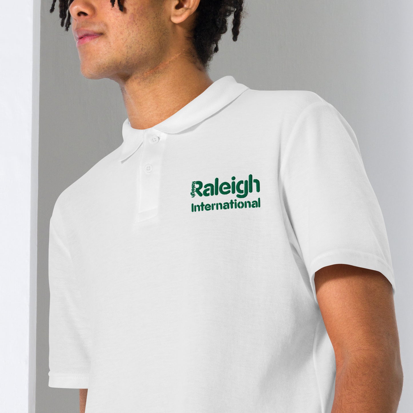 Raleigh unisex polo shirt (green logo)